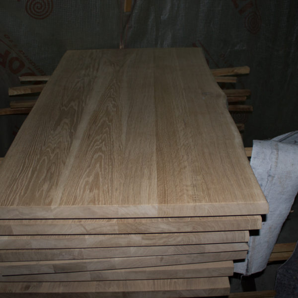 It is a lot of table-tops from oak wood without covering