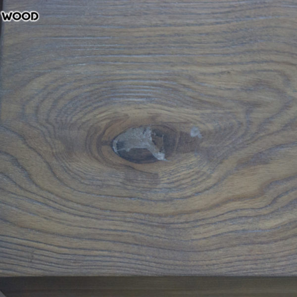 The photo of a part of a wooden table-top with a covering gray oil